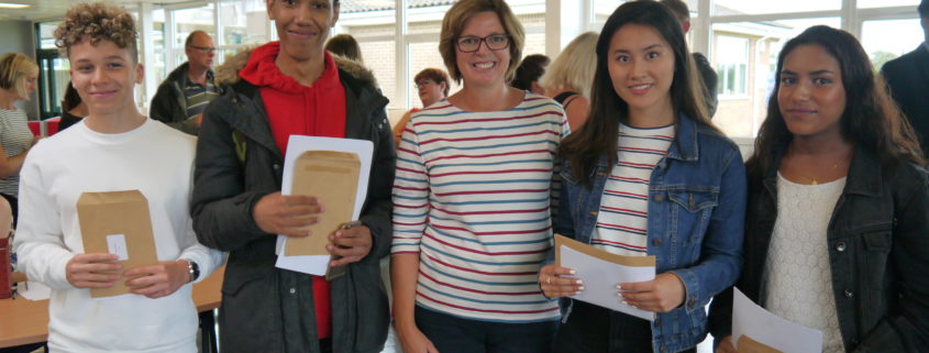 Mrs Hargreaves, head of Year 11, with Year 11 students.